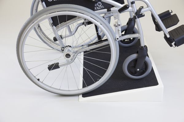 Wheelchair going up fibreglass ramp 
